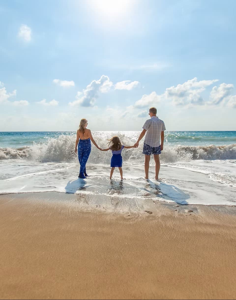 Family together on a South Bay beach